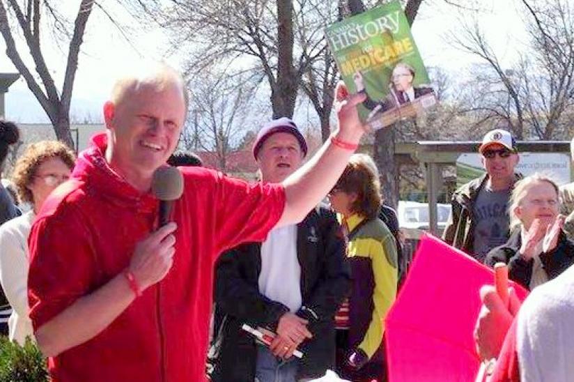 HEU vice president Ken Robinson speaks out against medicare cuts in front of MP Ron Cannan's office in Kelowna