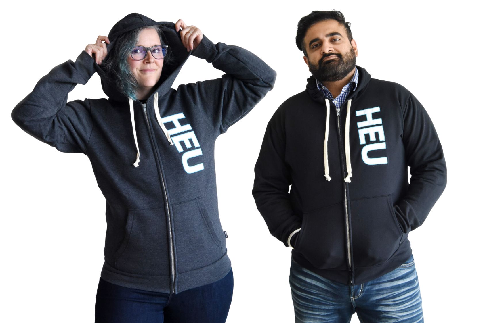 Two people wearing HEU-branded hoodies