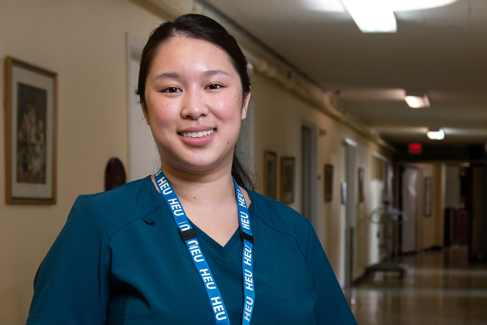 HEU care aide in hallway 