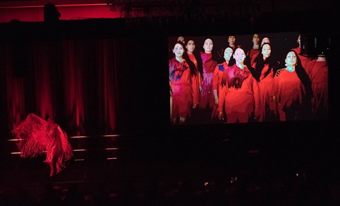 Indigenous women wearing red dresses