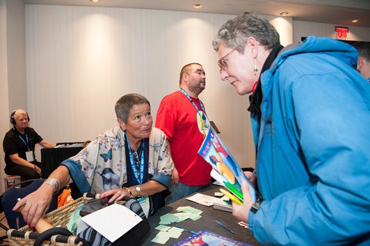 HEU member Joanne Foote shares information and promotes First nations culture at the union's Equity Night festivities.