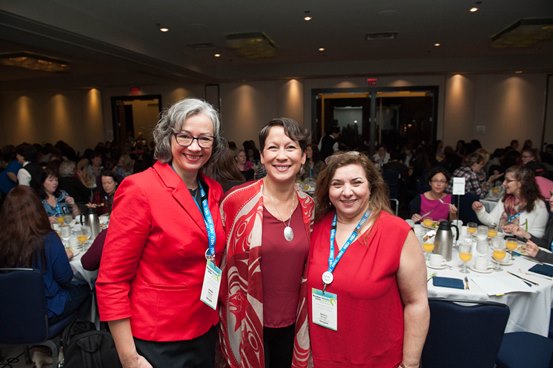 HEU secretary-business manager Jennifer Whiteside, NDP MLA for Vancouver-Mount Pleasant Melanie Mark and HEU Financial Secretary Donisa Bernardo at Women's Gathering