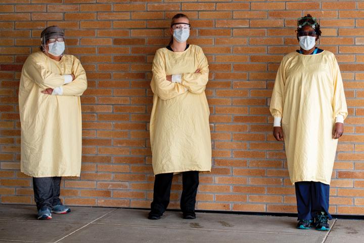 Healthcare workers in gowns and masks