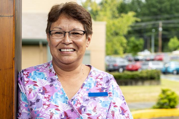 Member smiling outside facility