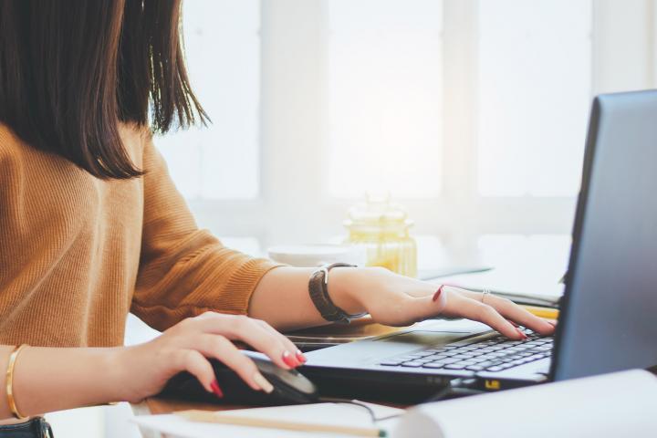 Woman working on laptop computer