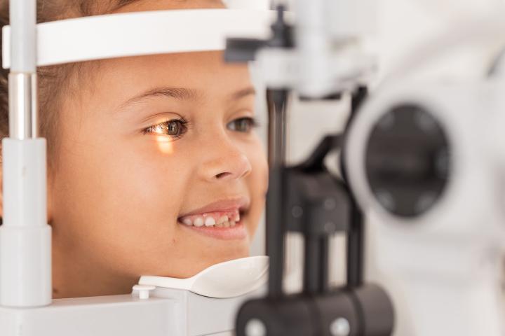 child getting vision tested