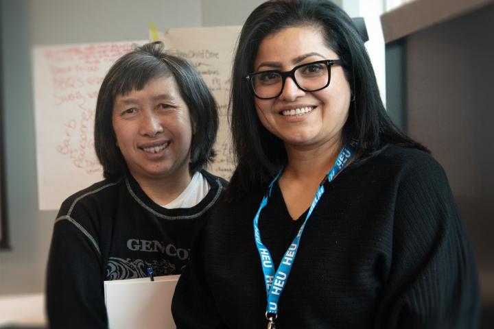 Two HEU members at a workshop