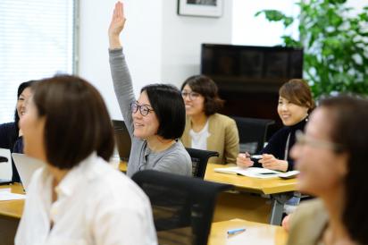 Workshop attendee raising hand to speak