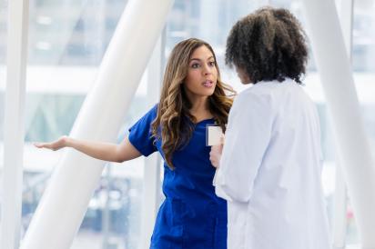 Two healthcare workers arguing