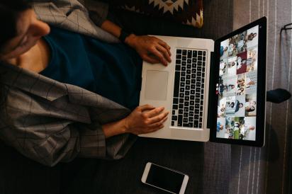 Woman with laptop in Zoom meeting