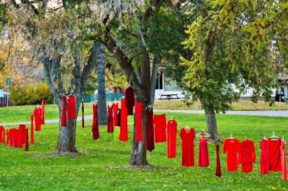 Red Dresses hanging on trees