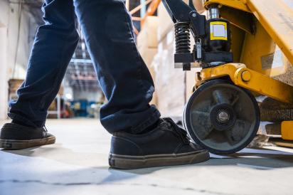 Young person operating heavy equipment