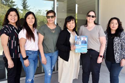 HEU FBA members holding copy of latest Comp Report