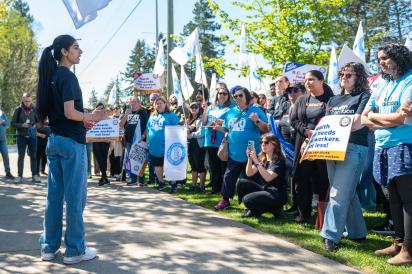 Jasveer, an HEU housekeeper, speaks at a rally in Surrey