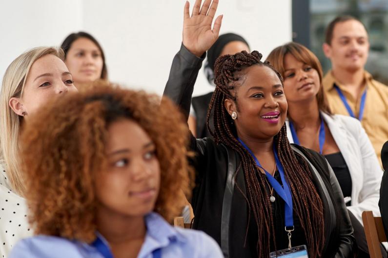 workshop participant raising hand to speak