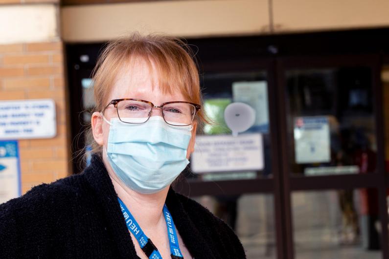 Member story clerk/front door screener outside hospital