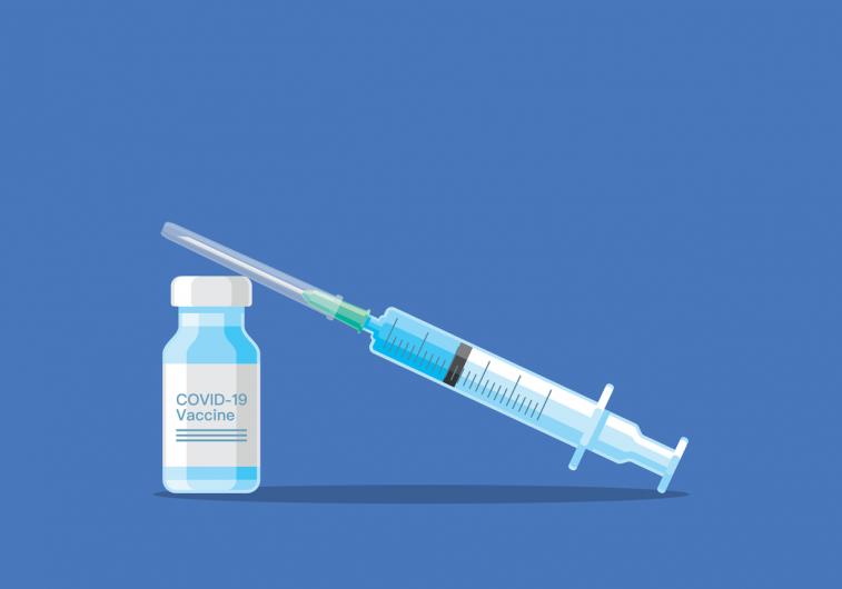 Covid 19 vaccine and syringe with blue background