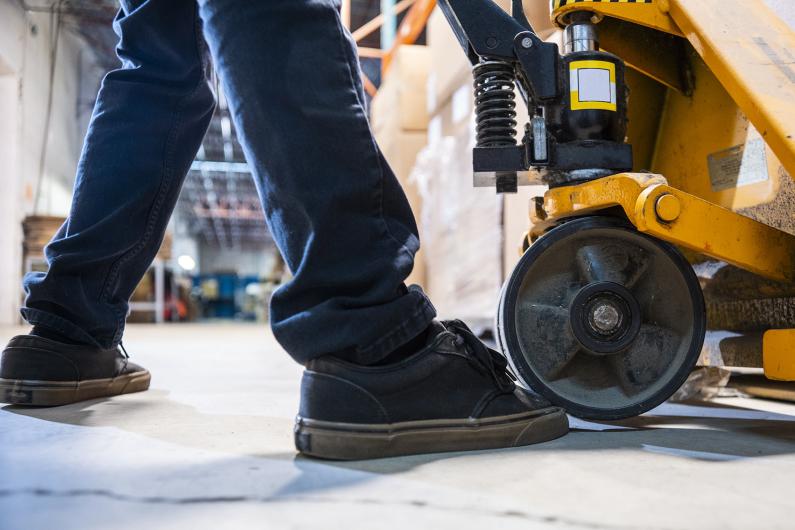 Young person operating heavy equipment