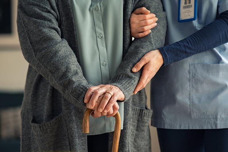 Care aide assisting a senior